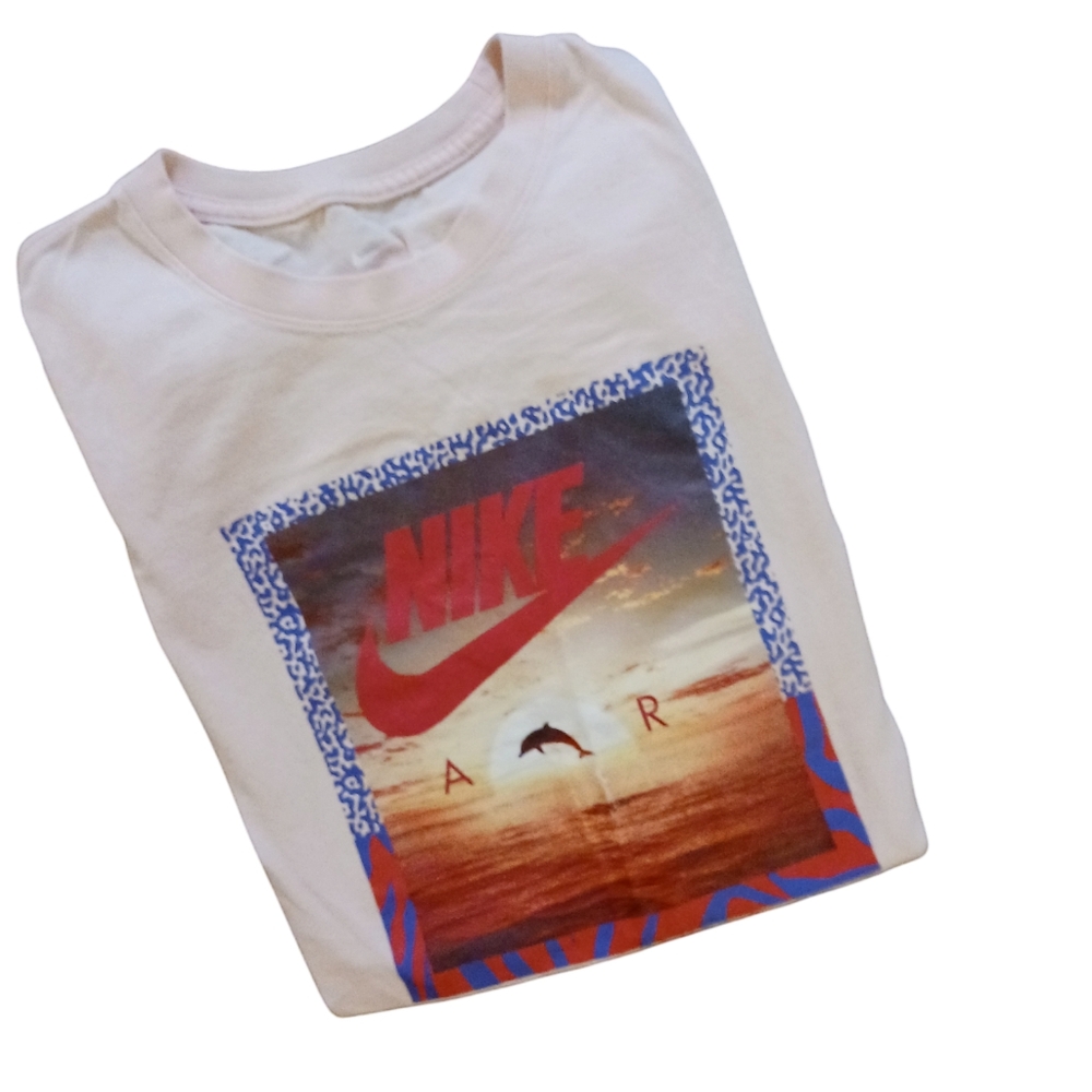 THE NIKE AIR DOLPHIN GRAPHIC TEE. Womens.  Size Large.  Tee is a light peach.